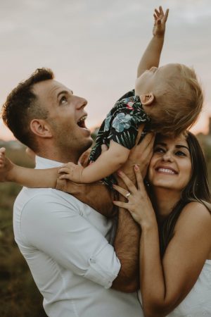 Happy family holding son